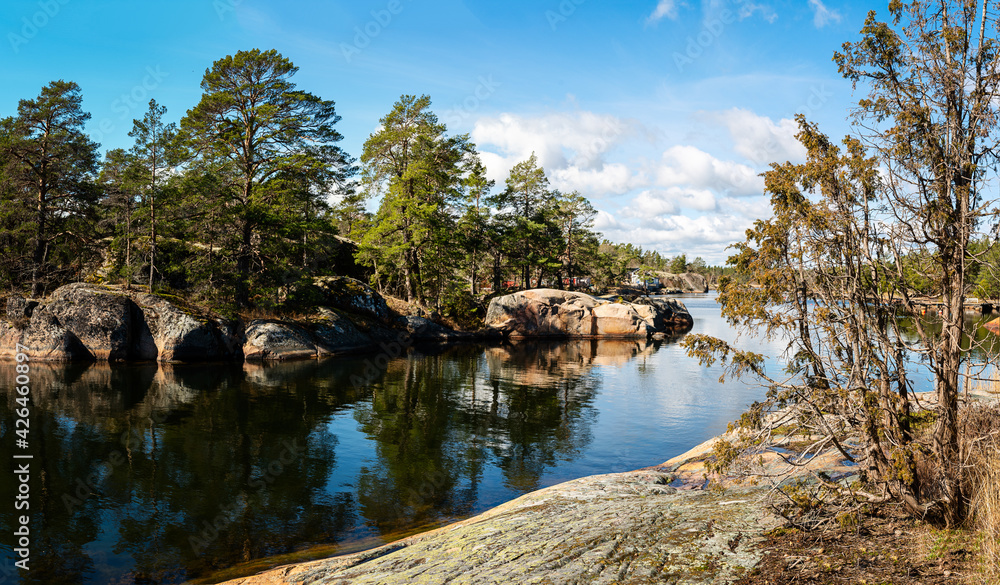 Panorama view of beautiful landscape in the Swedish archipelago. Sunshine, water and coastline features. Photo taken outside Oskarshamn, Sweden