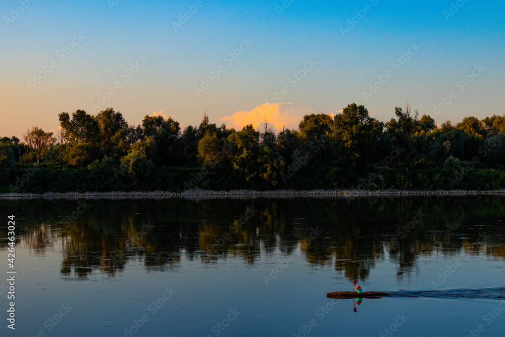 Po river kayaking at italian sunset summer