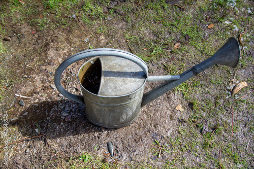 Old watering can made of metal