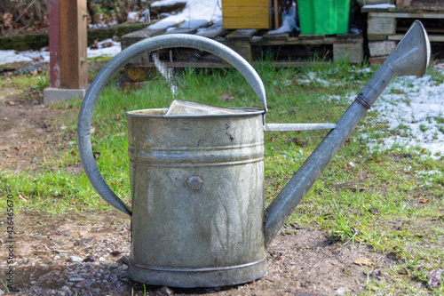 Old watering can made of metal