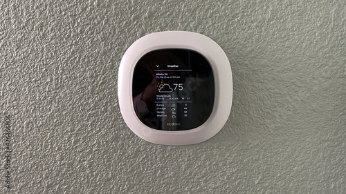 Принти на полотні An Ecobee smart thermostat in a home.