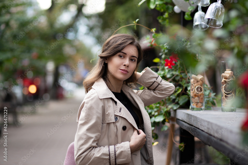 Glamor woman sitting at the street cafe in the morning Glamor woman sitting at the street cafe in the morning