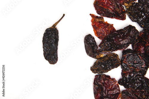arrangement of Mexican Chipotle Peppers (dried jalapeño, Capsicum annuum, Morita Variety), isolated on a white background
 photo