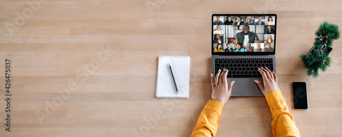 Online business briefing, virtual meeting. Panoramic photo of laptop screen with webcam shots of multi ethnic business partners communicates from home by a video conference, online webinar. Copy space