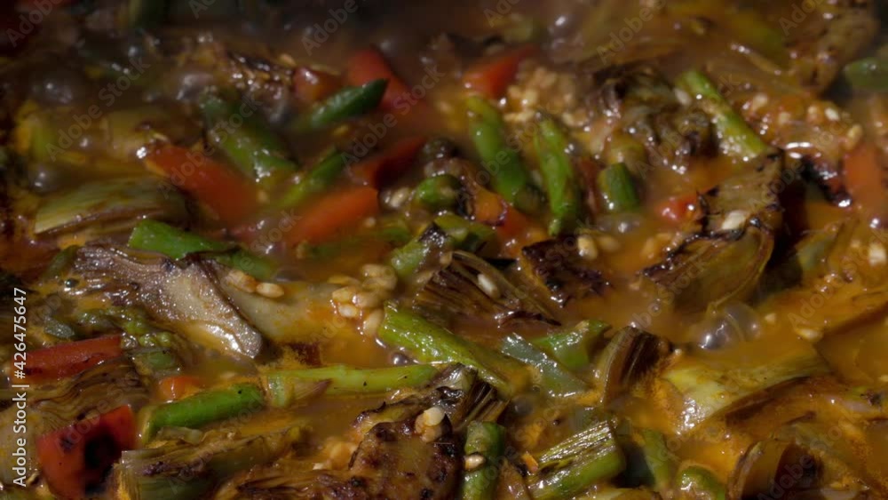 Close up video of cooking a paella Close up video of cooking a paella