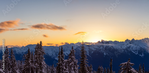 Panoramic View of Canadian Nature Landscape on top of snow covered mountain and trees during colorful spring sunset. Taken on a hike up Elfin Lake in Squamish, North of Vancouver, BC, Canada. © edb3_16