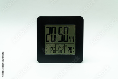Black alarm clock, with weather station isolated on a white background
