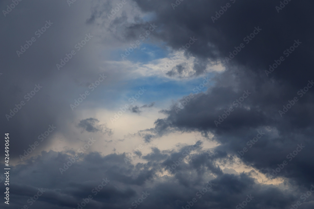 Epic Dramatic Storm sky, dark gray fluffy cumulus clouds background texture, thunderstorm