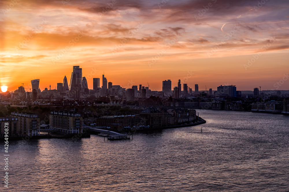 Wide panoramic view to the skyline of London along the river Thames, United Kingdom, during sunset time