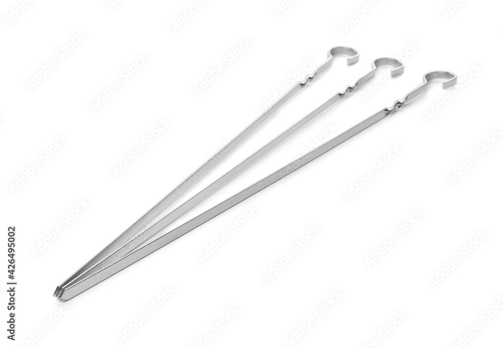 Metal skewers on white background. Barbecue utensil Metal skewers on white background. Barbecue utensil
