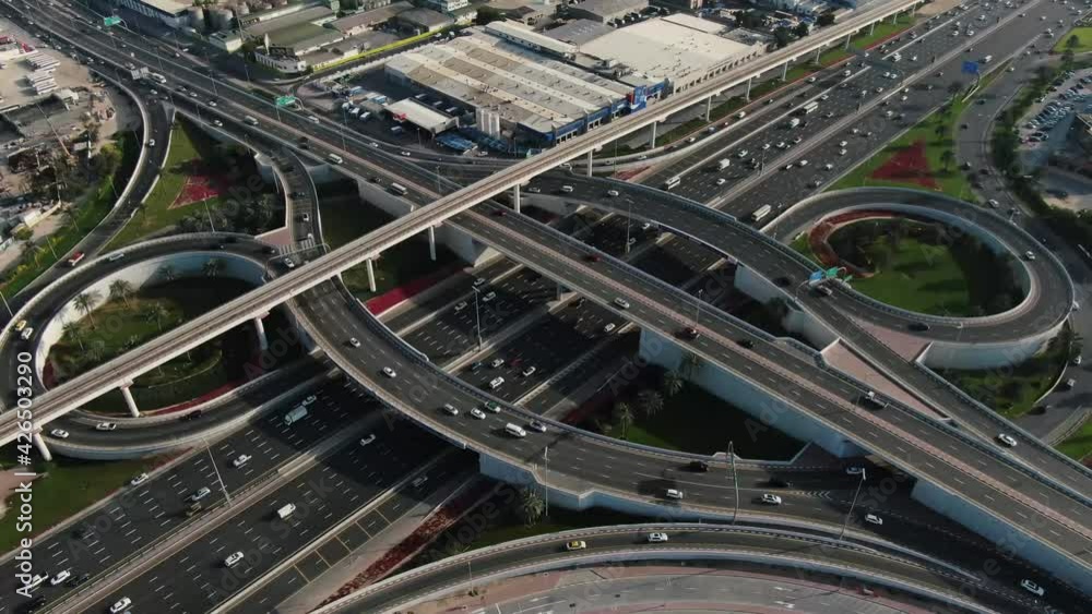 Traffic is passing across a very busy highway intersection in Dubai, UAE, 4k Traffic is passing across a very busy highway intersection in Dubai, UAE, 4k