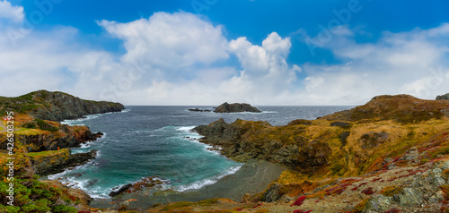 Panoramic seascape view on a rocky Atlantic Ocean Coast. Colorful Blue Sky Art Render. Taken at Crow Head, North Twillingate Island, Newfoundland and Labrador, Canada.