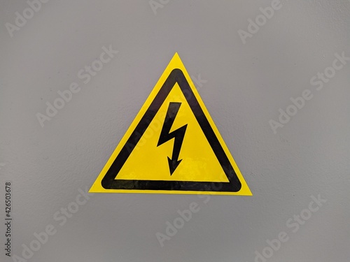 Free Download black and yellow voltage sign on gray background photo - GFXLoad