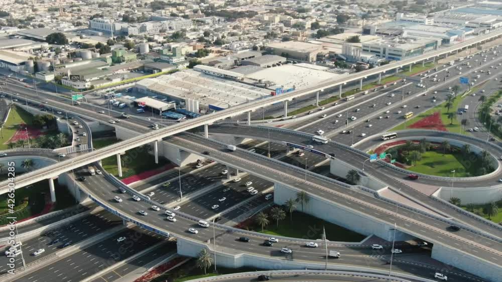 Massive highway intersection in Dubai with lots of traffic passing through, 4k Massive highway intersection in Dubai with lots of traffic passing through, 4k