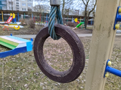 one wooden gymnastic ring on the playground