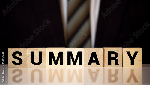 Fotografie Summary word from wooden blocks on desk