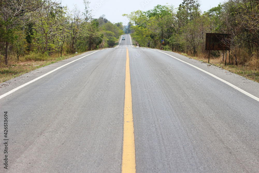 Obraz premium black asphalt road transport with yellow line