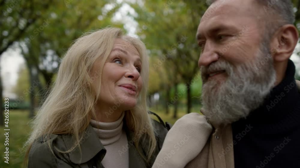 Portrait of cheerful married couple having fun outdoors. Smiling caucasian man. Portrait of cheerful married couple having fun outdoors. Smiling caucasian man.