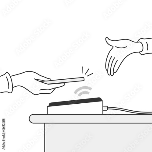 Holding smartphone over payment machine. Popular cashless and contactless payment method.