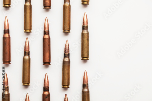 Fotografija A group of bullet ammunition shells on a white background