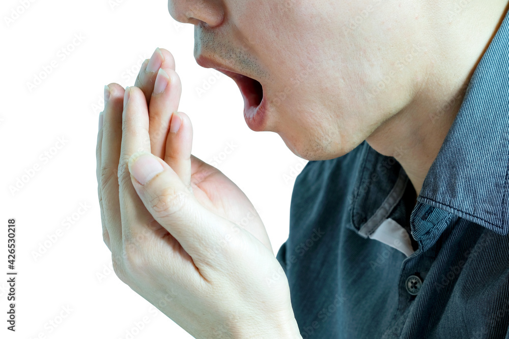 Fototapeta premium Oral health Men use hands to check for bad breath and breathe.