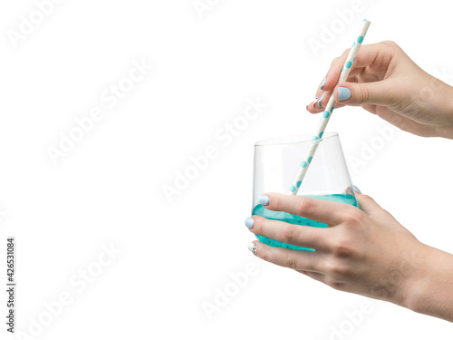 Female hands with cocktail glass isolated on white background.