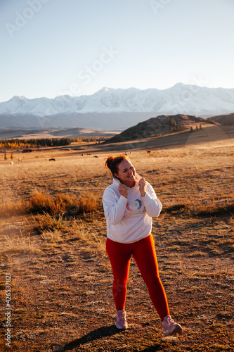 Wallpaper Mural Happy young woman in Kurrai steppe in Altai Republic in early autumn Torontodigital.ca