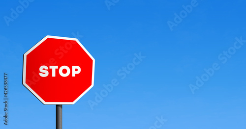 Stop road sign octagon in blue clear sky 
