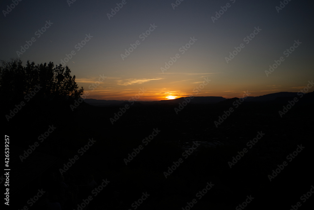 A aerial view of a sunset in Sedona Arizona during the spring.