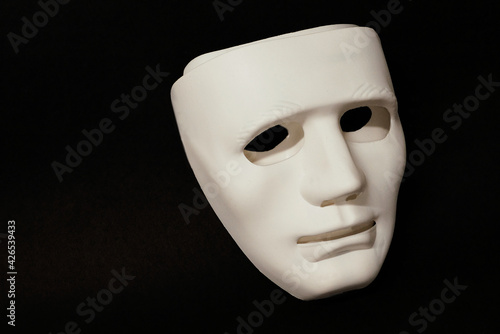 Theatrical mask set at an angle to give the viewer an impression of eye movement.