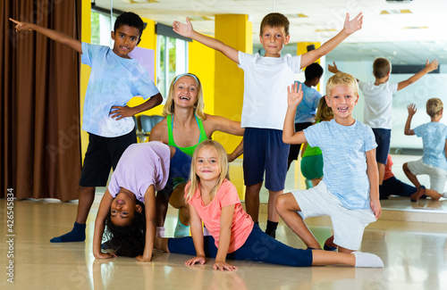 Positive children in dance studio smiling and having fun. High quality photo