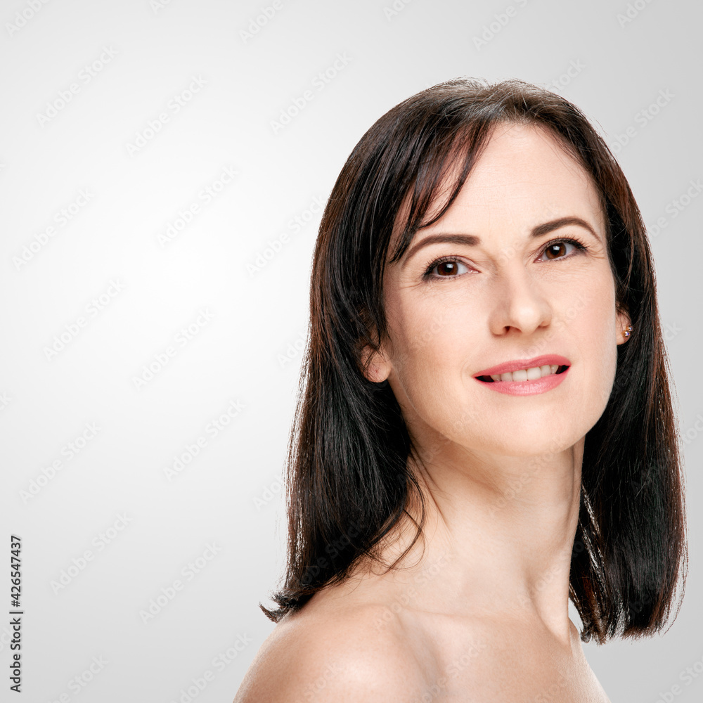 Beautiful middle aged woman with short brown hair and clean face Beautiful middle aged woman with short brown hair and clean face