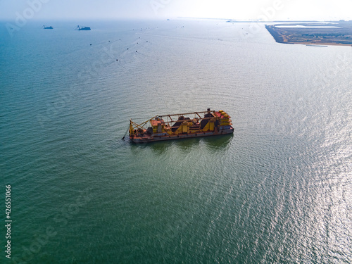 Aerial photography of giant oil tanker sand mining ship at sea