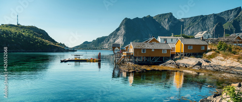 View of the city of Rhine on the Lofoten islands, a beautiful bright landscape, yellow houses on the beach