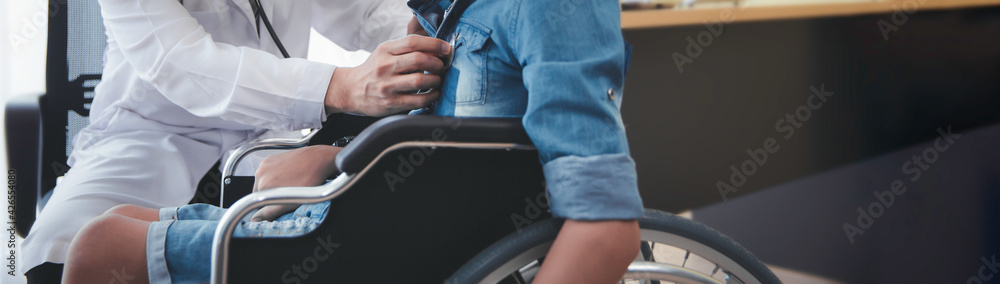 Asian doctor use stethoscope checkup  disability wheel chair patient  person