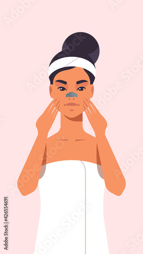 young woman applying skin cream dressed in towel girl cleaning and care her face skincare spa relax facial treatment concept portrait