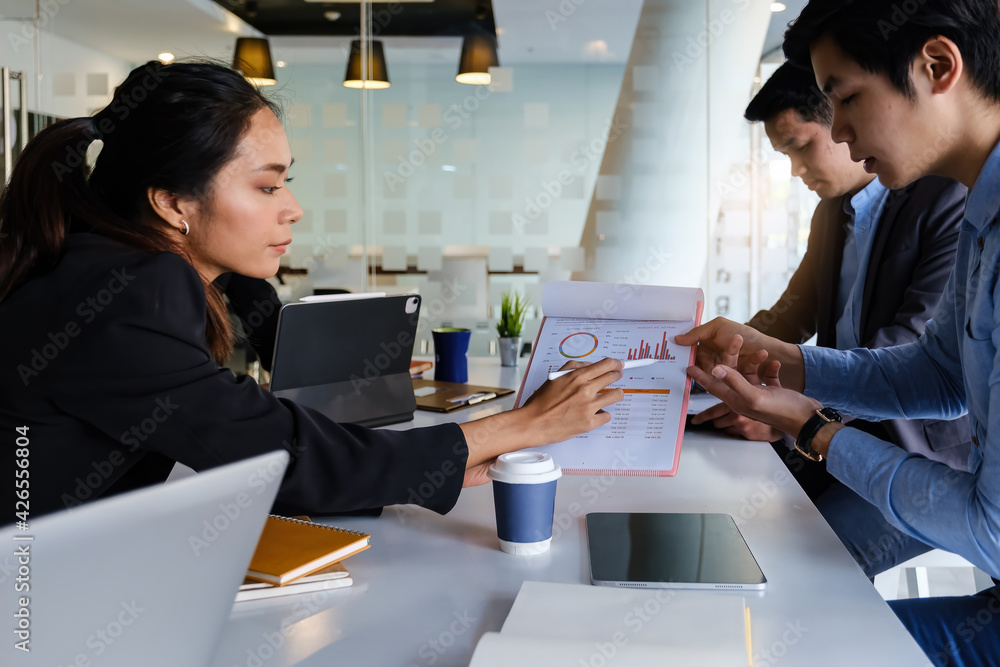 Group of Businessman and Accountant checking data document on digital tablet for investigation of corruption account . Anti Bribery concept. Group of Businessman and Accountant checking data document on digital tablet for investigation of corruption account . Anti Bribery concept.