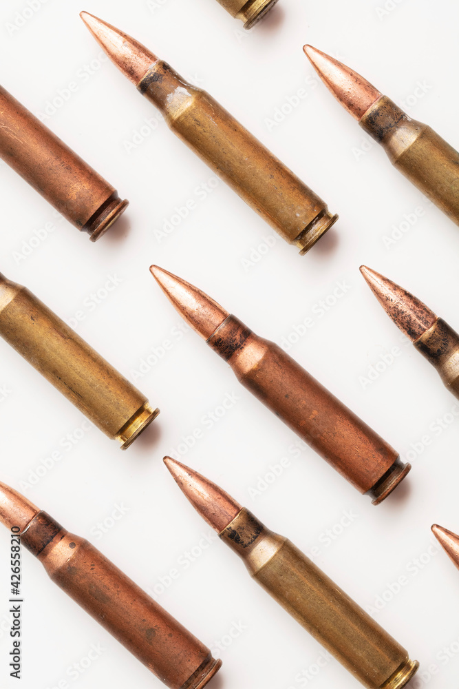 A group of bullet ammunition shells on a white background