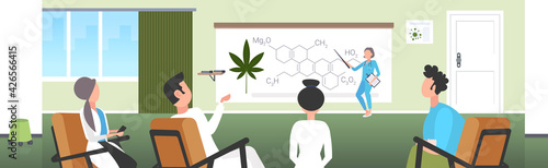 scientist presenting CBD THC cannabis hemp drug molecule for doctors team at conference meeting medical marijuana formula presentation concept horizontal