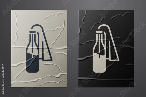 White Cocktail molotov icon isolated on crumpled paper background. Paper art style. Vector