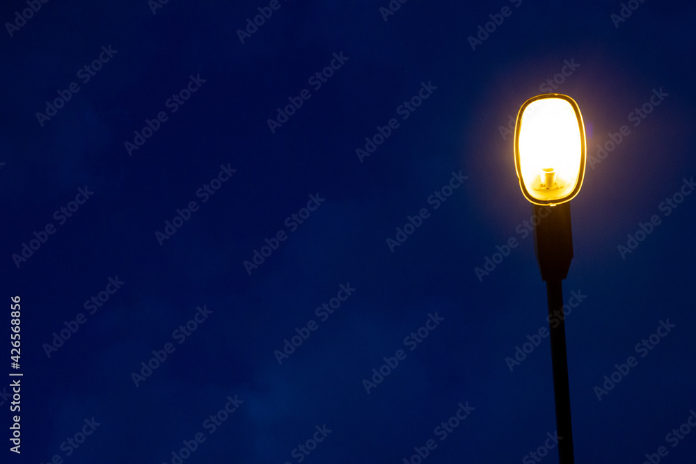 Street light pole on dark blue sky background at during the night. Coppy space Street light pole on dark blue sky background at during the night. Coppy space