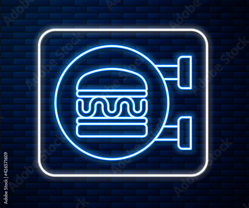 Glowing neon line Online ordering and burger delivery icon isolated on brick wall background. Vector