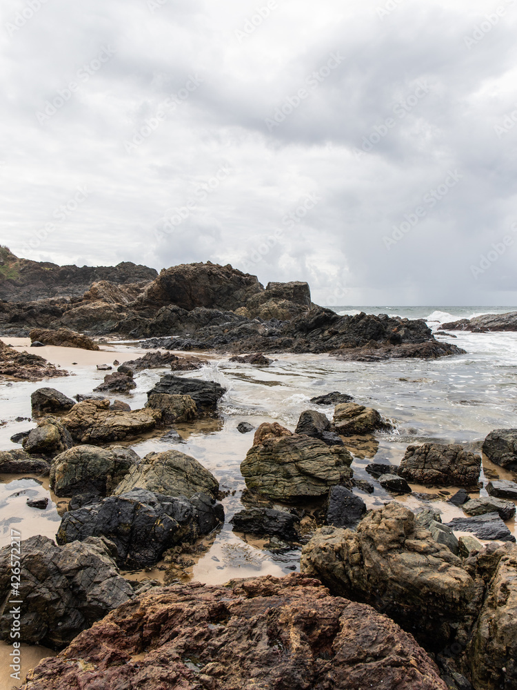 Cloudy view of rocky beach coastline at Port Macquarie, Australia.
