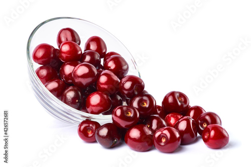 glass bowl of sweet cherry fruits isolated on white background