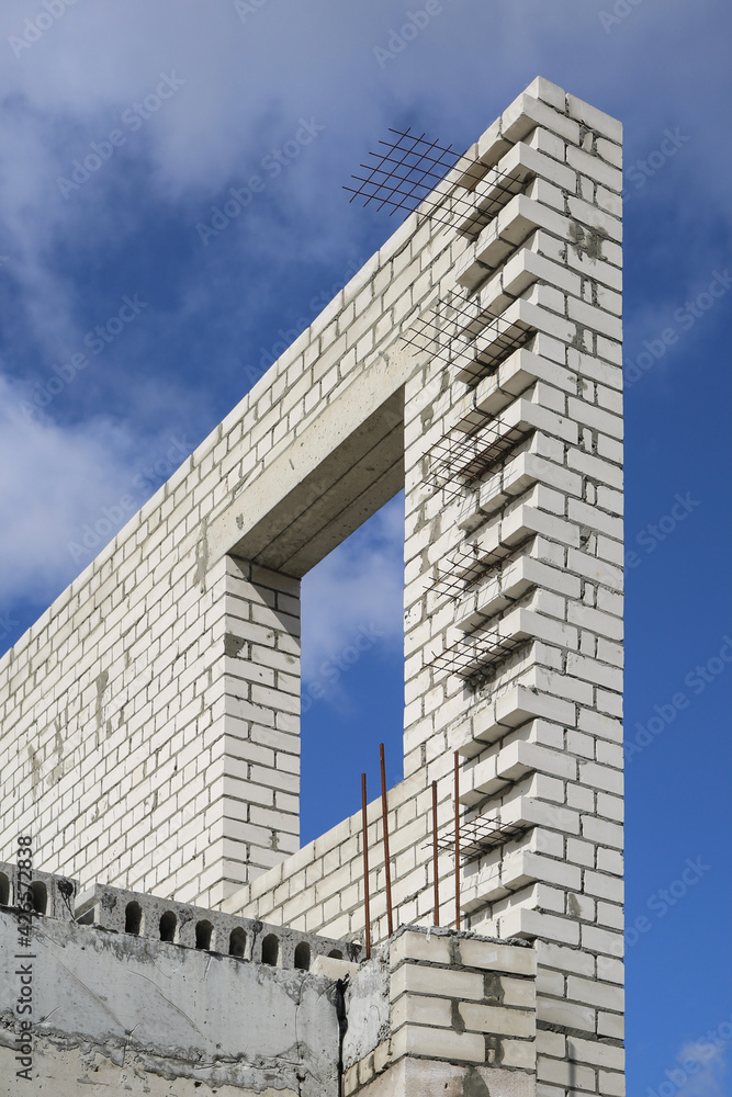 Fragment of the wall of a house under construction. Fragment of the wall of a house under construction.