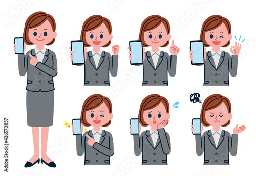 スマートフォンを持っているスーツを着た女性のイラストセット