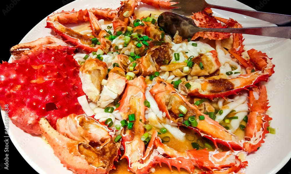 king crab legs meat on white plate