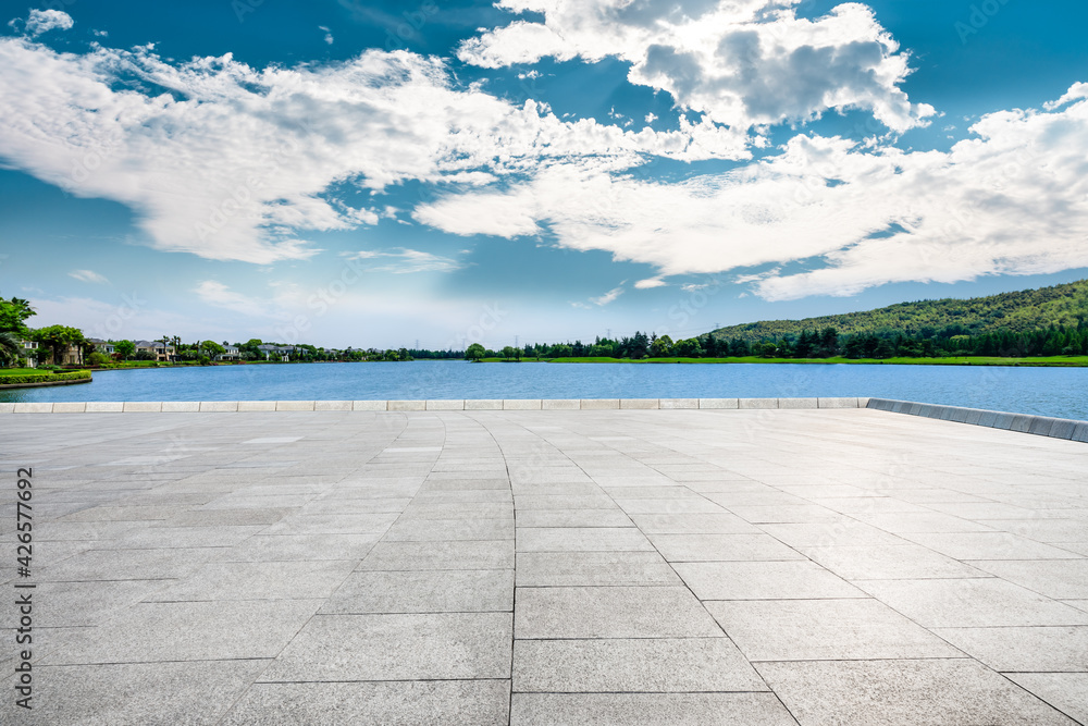 Empty square floor and mountain with lake landscape under the blue sky.