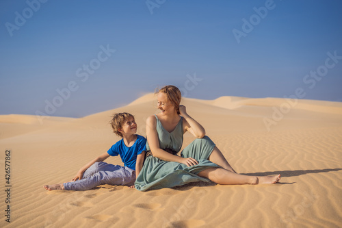Mother and son in the desert. Traveling with children concept. Tourism reopens after quarantine COVID 19
