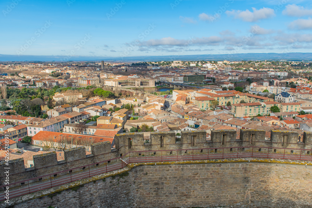 Aerial view of the city of Carcassonne with the church from the castle of Carccasonne, background blue sky
